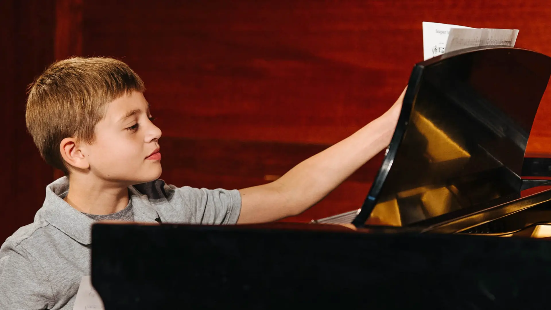 Student working through a piano exercise with a coach