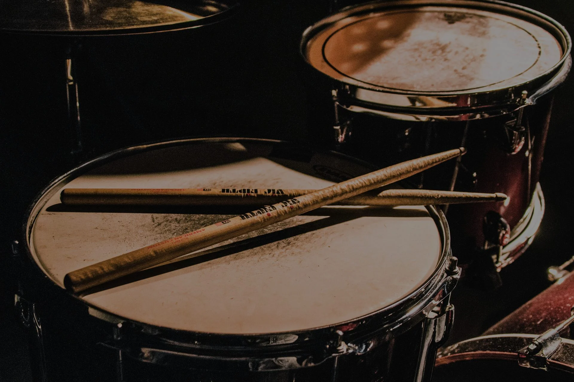 Musician performing on a drum kit