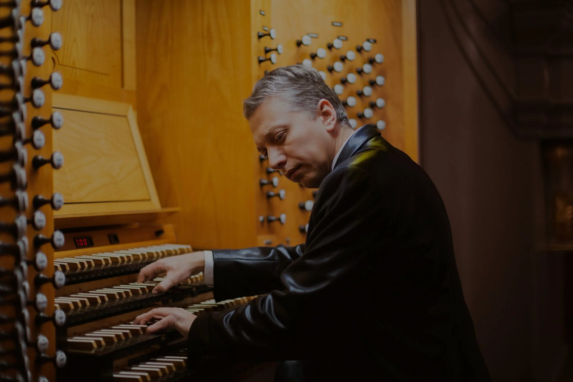 Musician performing on an organ
