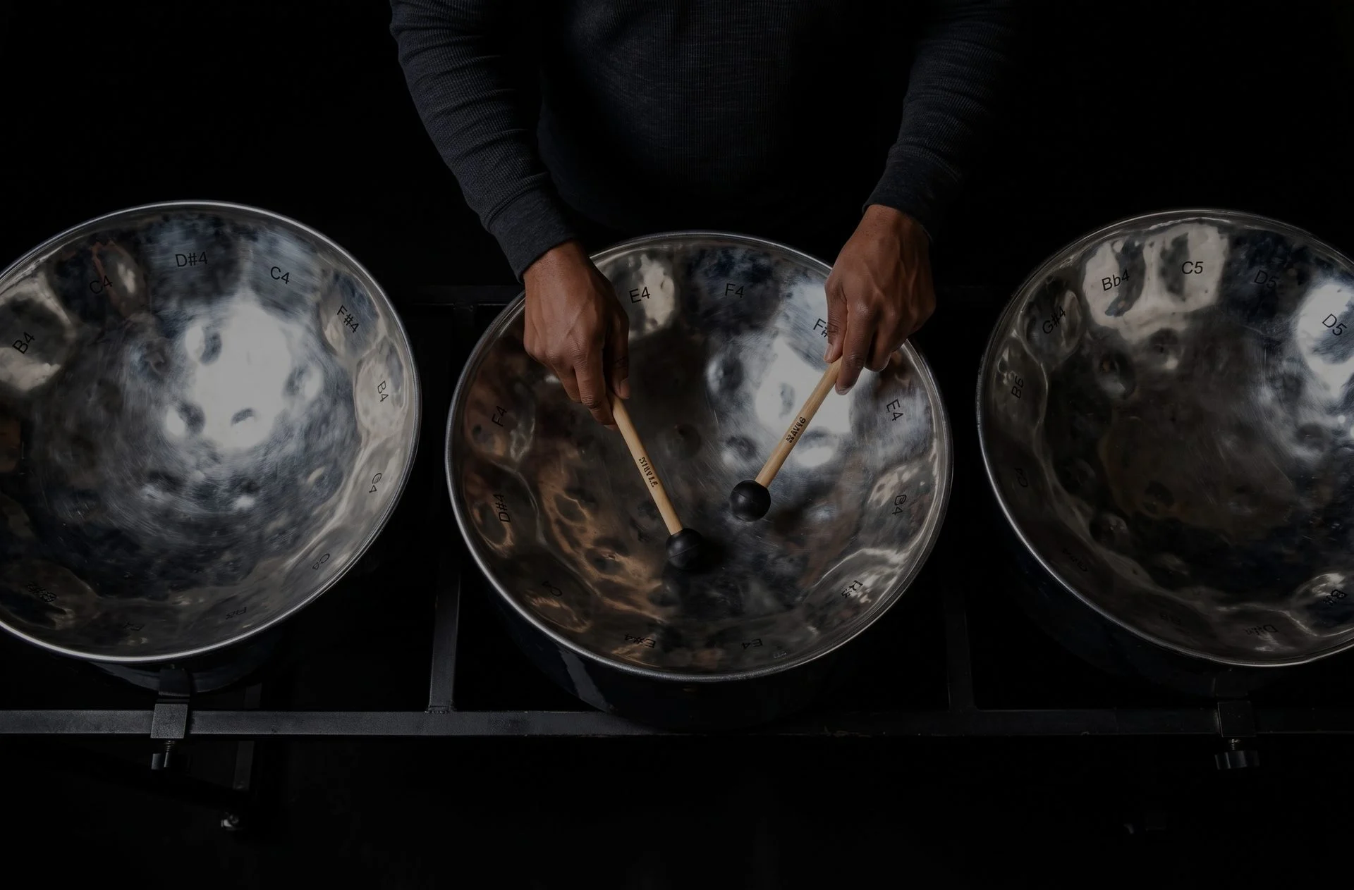 Musician playing steel pan drums