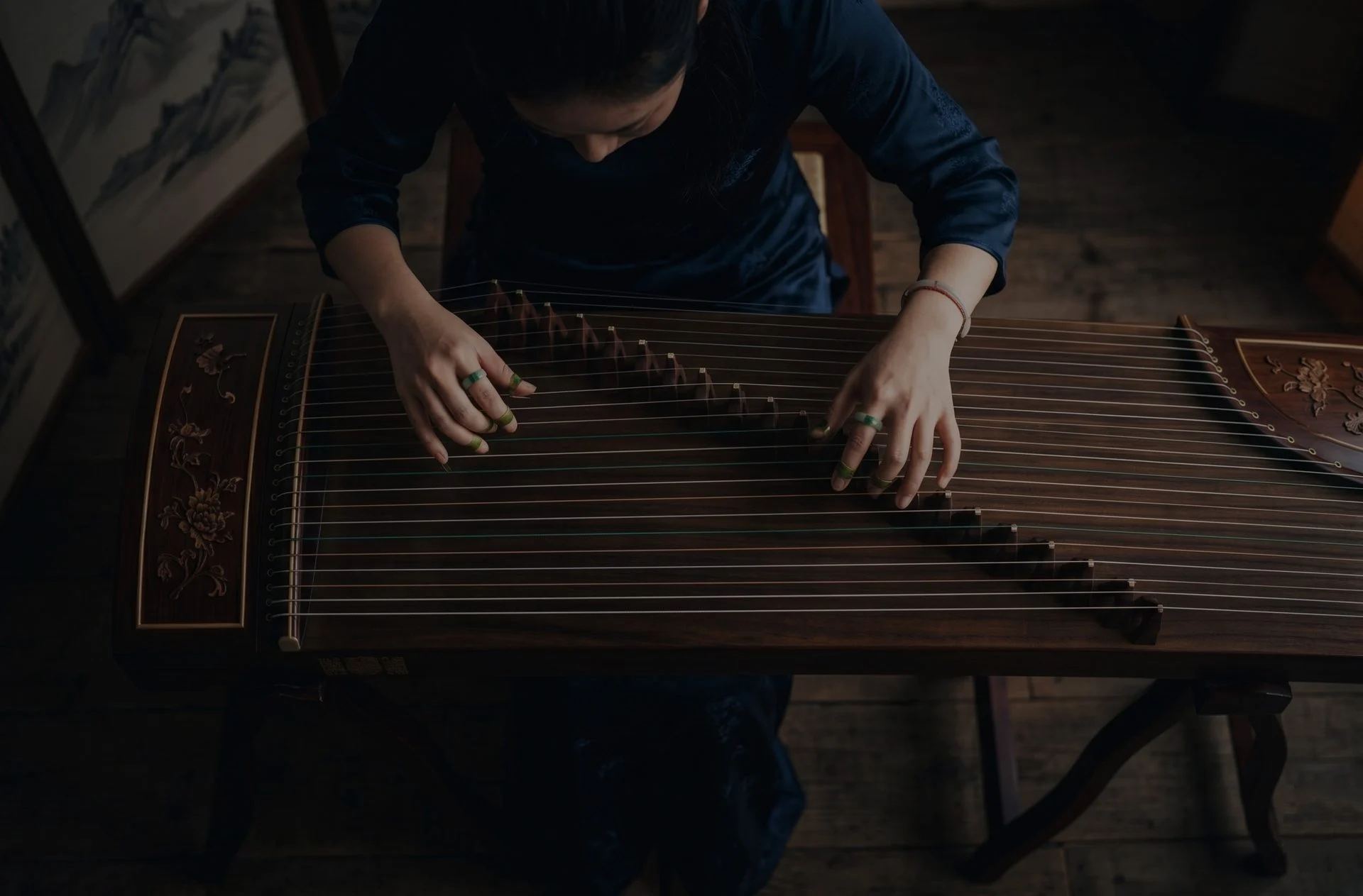 Musician performing on a traditional world-music instrument