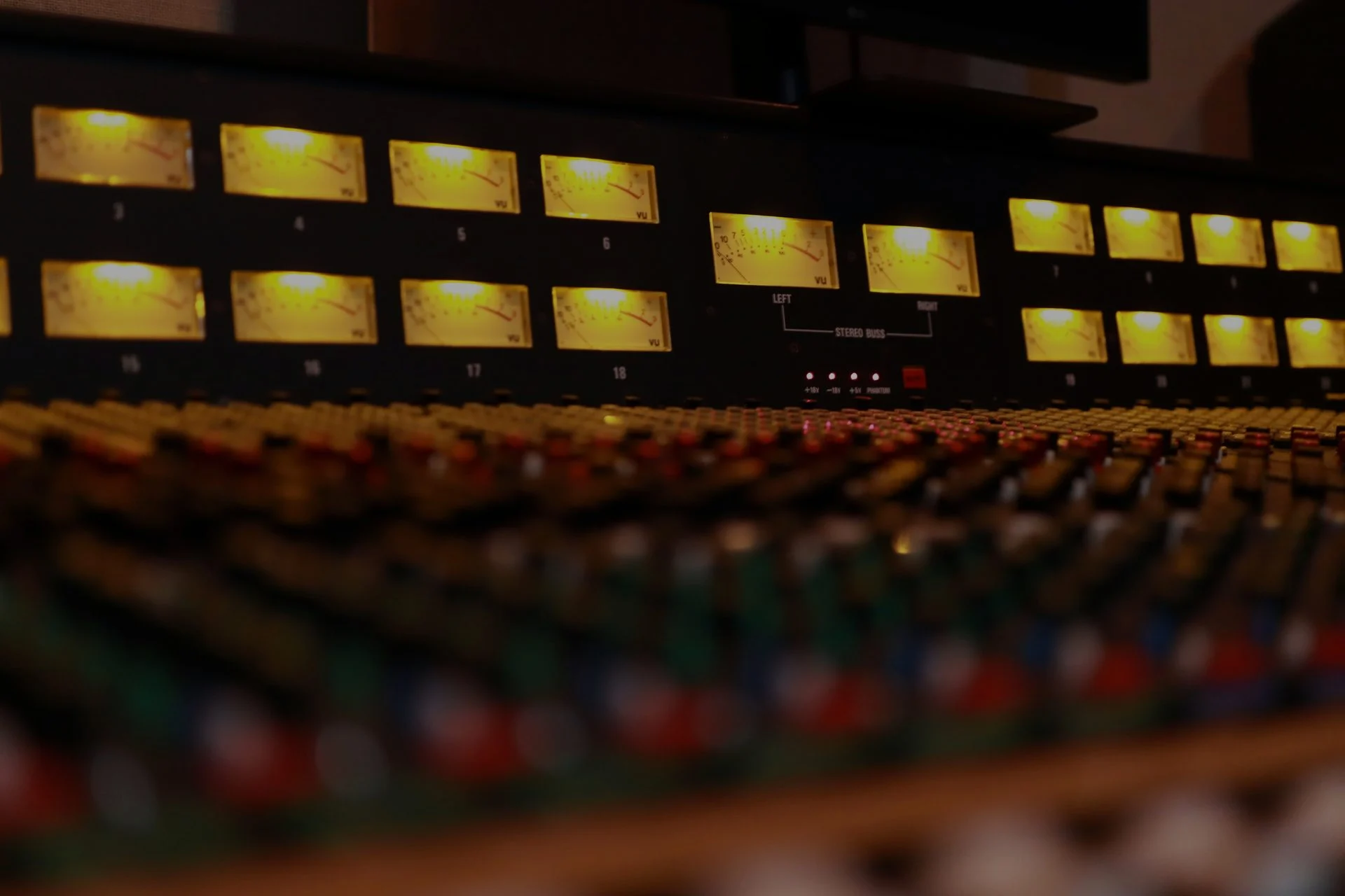 Recording studio with monitors, outboard gear, and a mixing desk