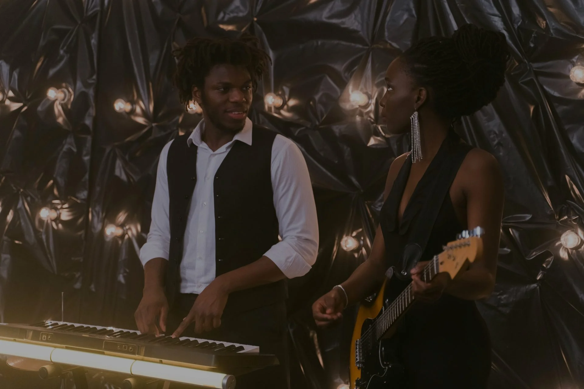Vocalist performing with a microphone in a studio or stage setting