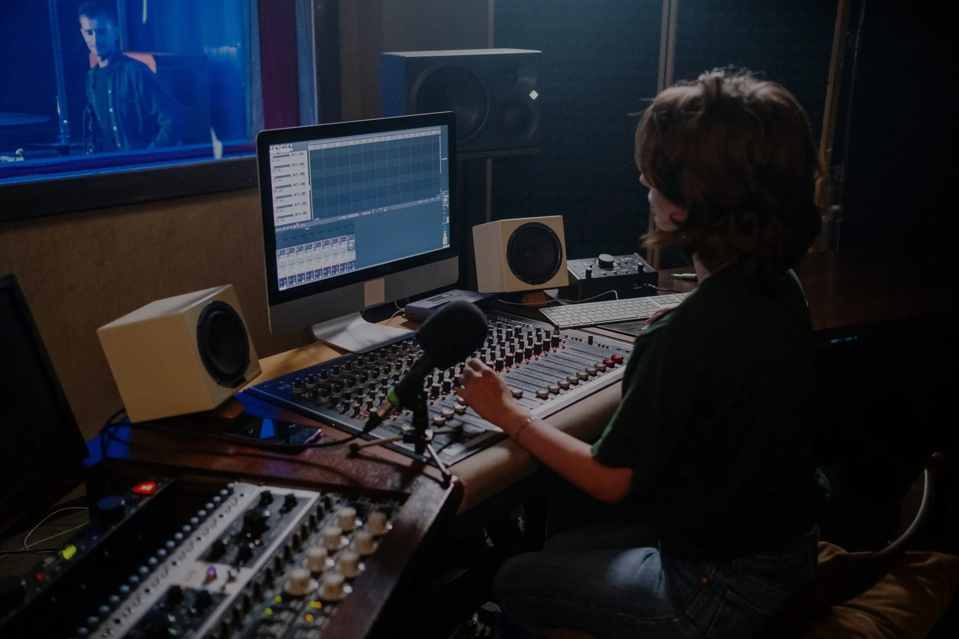 Recording studio with monitors, outboard gear, and a mixing desk