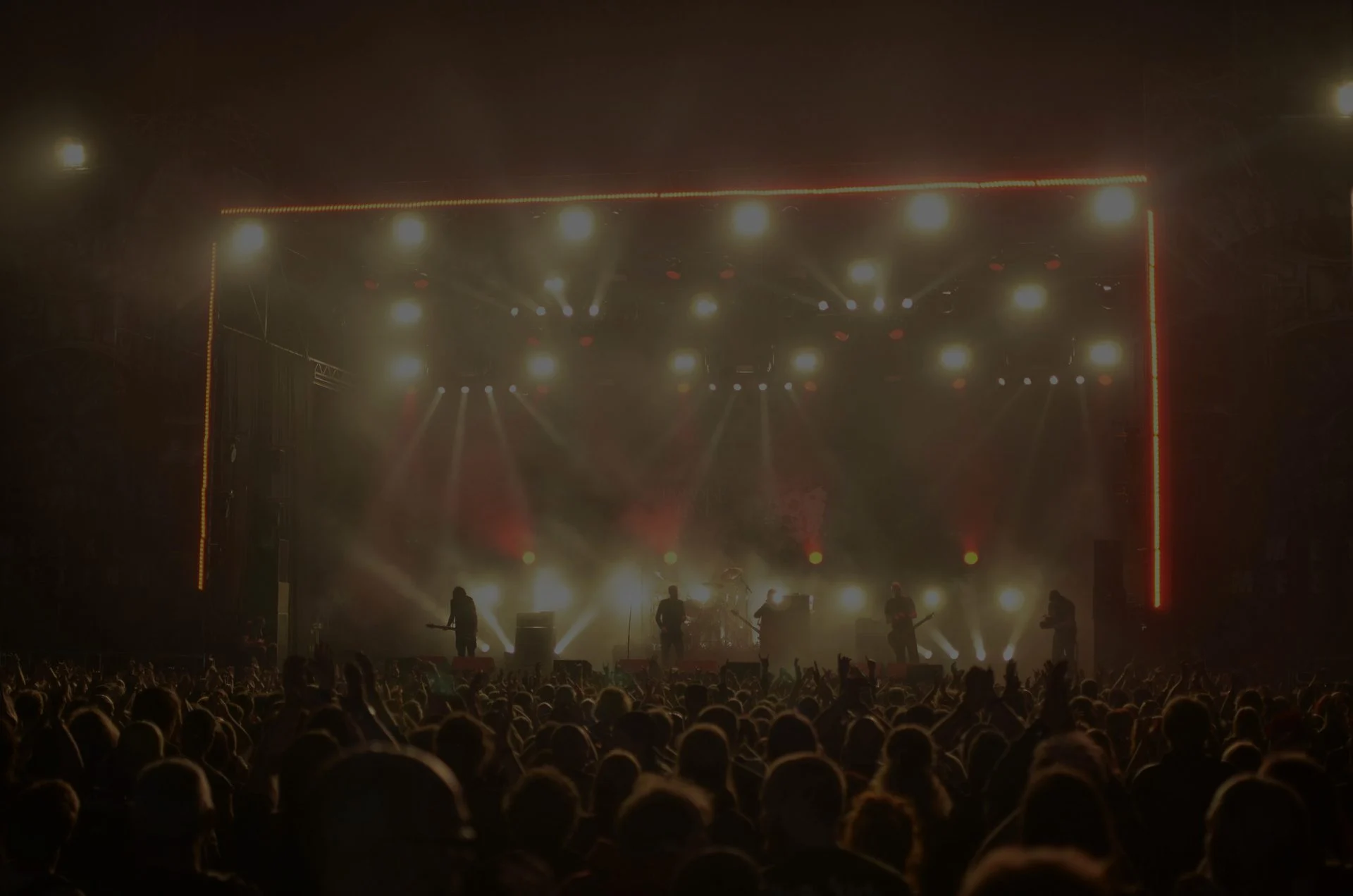 Vocalist performing with a microphone in a studio or stage setting