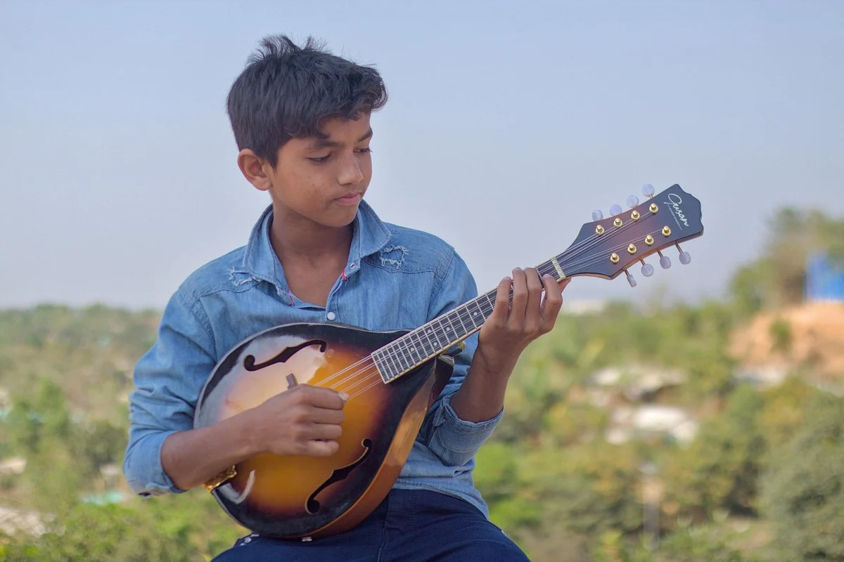 Mandolin lesson — student practicing with an instructor