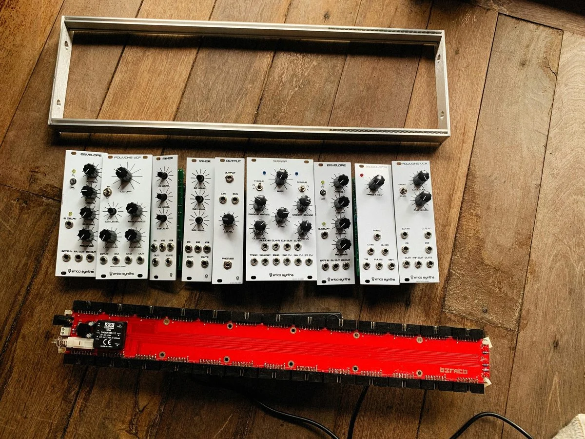 Synthesizer Programming lesson — student and instructor at a studio workstation