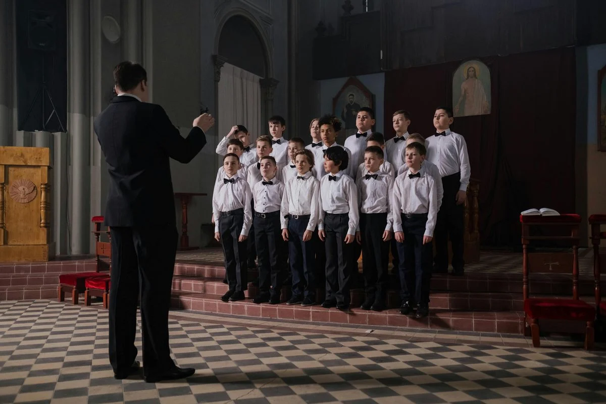 Vocal coach guiding a singer through a countertenor exercise