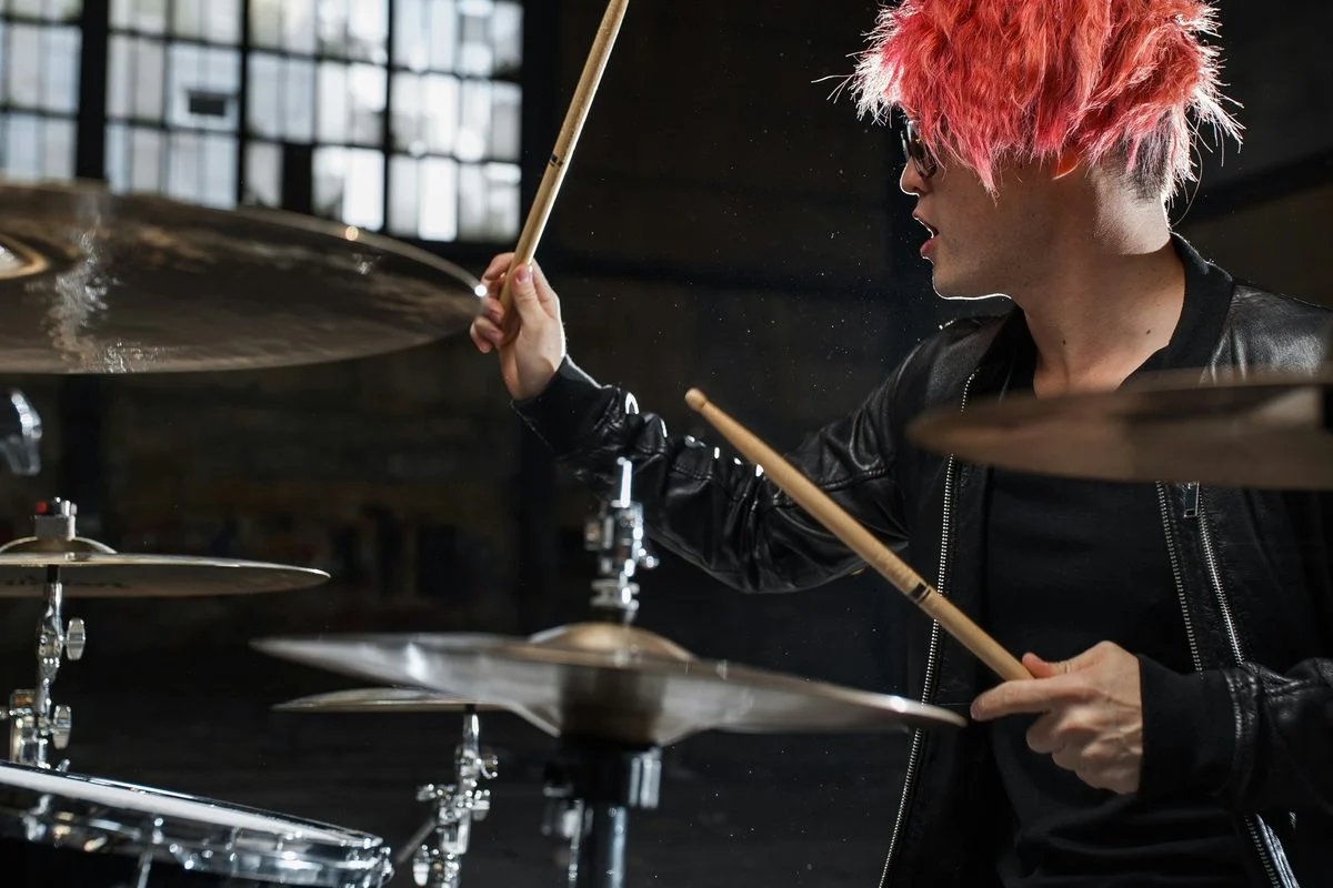 Drums & Percussion teacher demonstrating technique for a student
