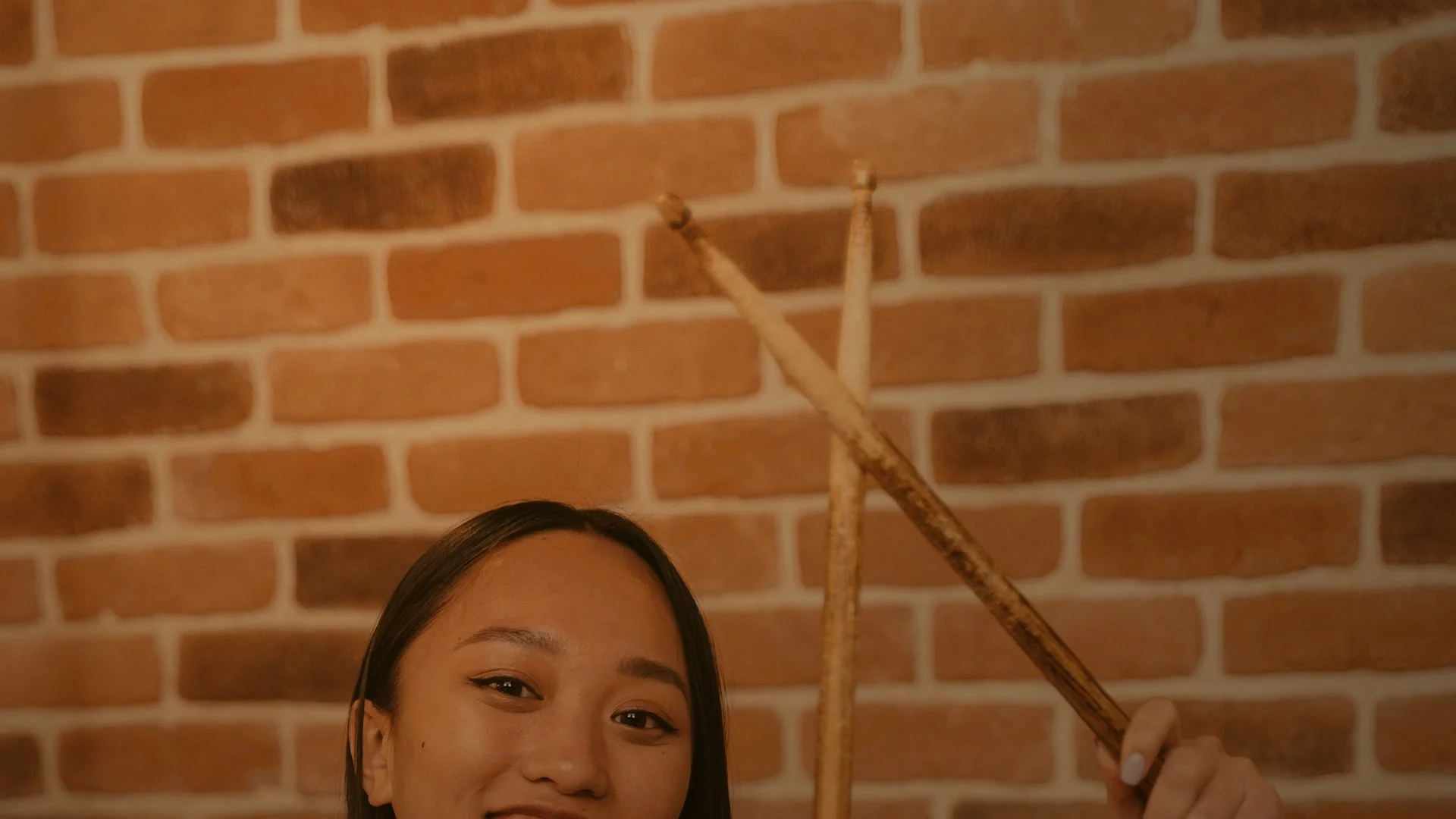 Drum teacher demonstrating technique for a student