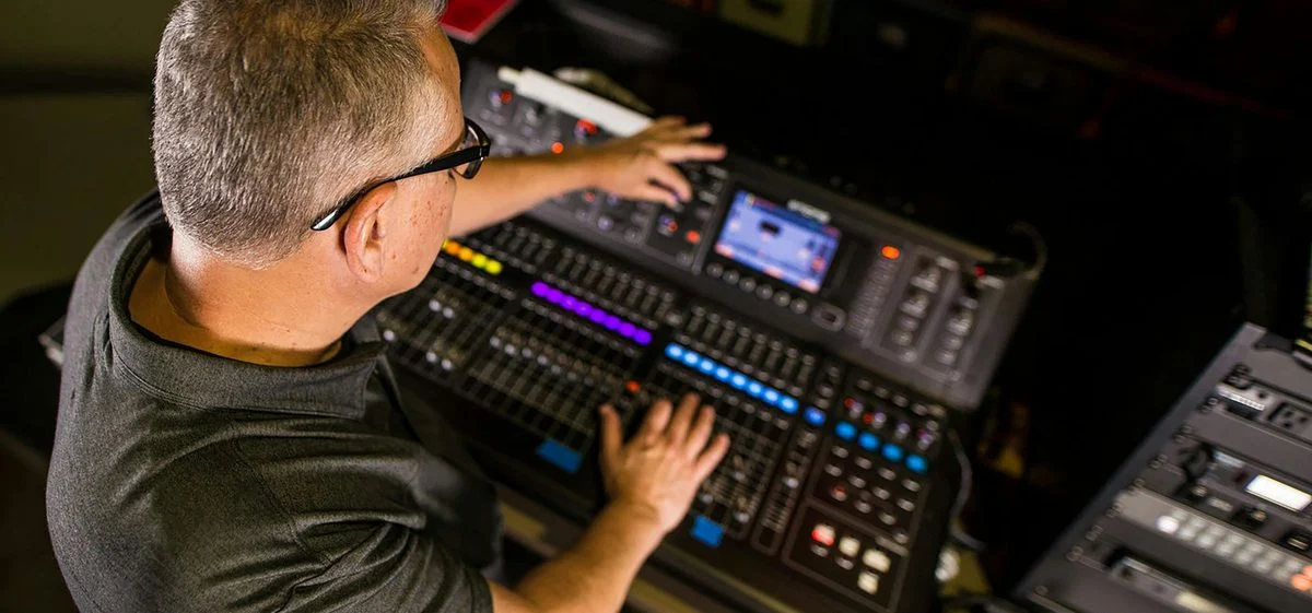 Student working on a DAW session with a producer-mentor