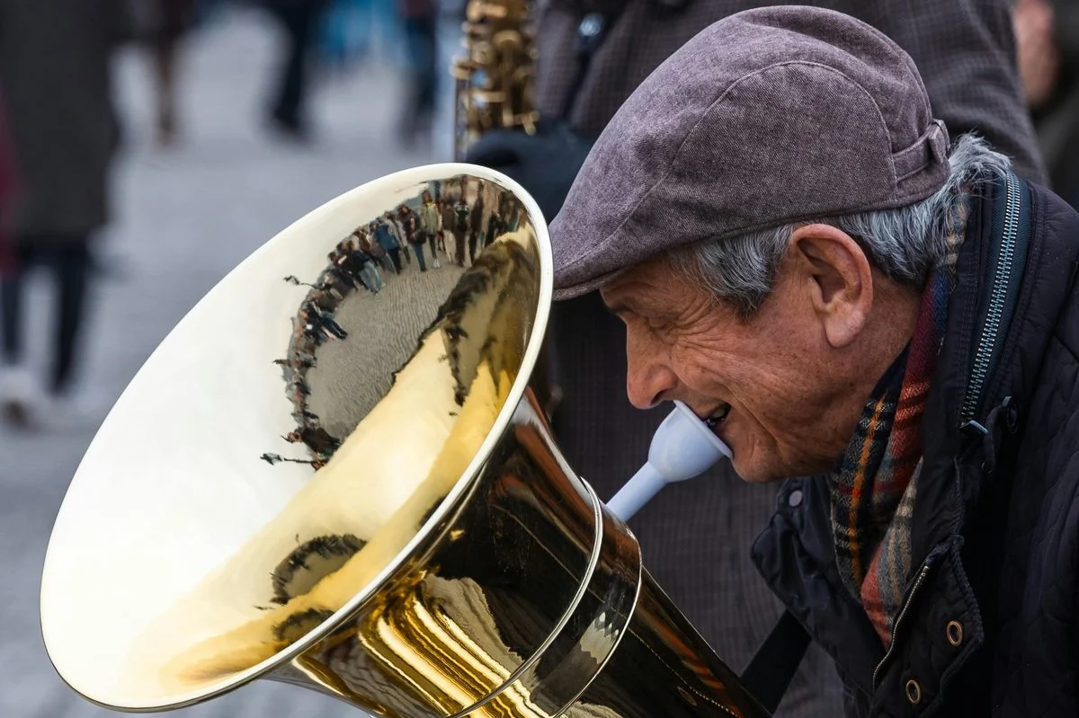 Tuba teacher demonstrating technique for a student