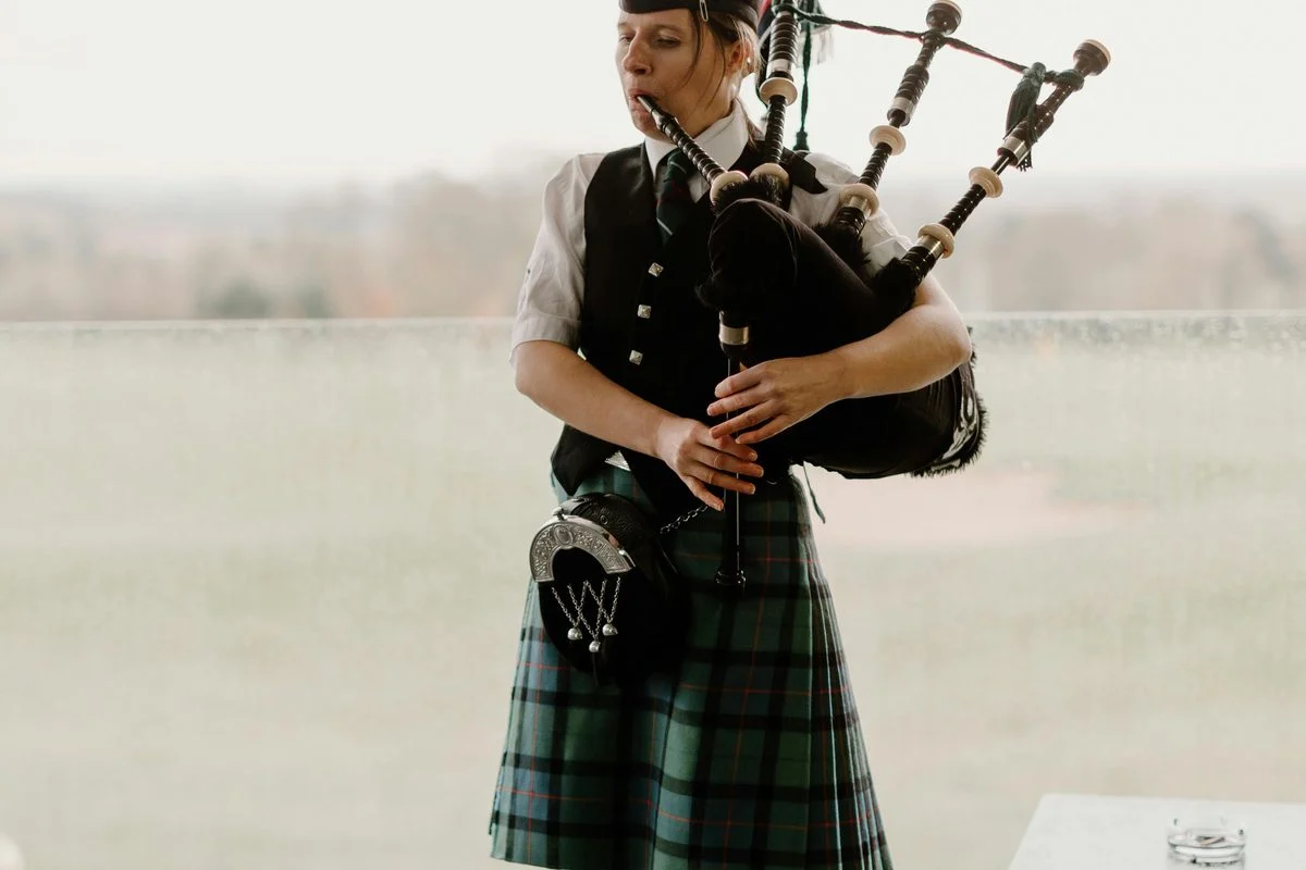 World & Traditional Music teacher demonstrating technique for a student