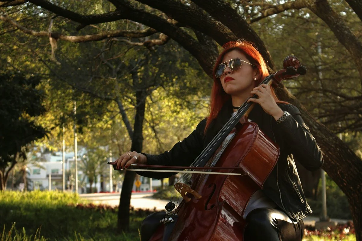 Student working through a cello exercise with a coach