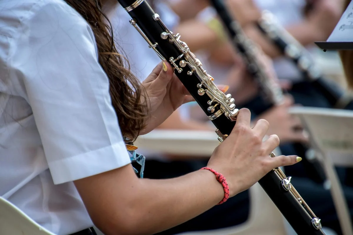 Student working through a clarinet exercise with a coach