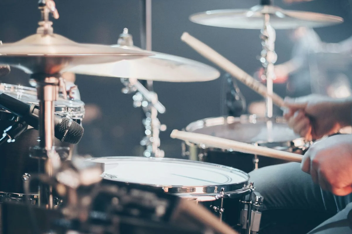 Student working through a drums & percussion exercise with a coach