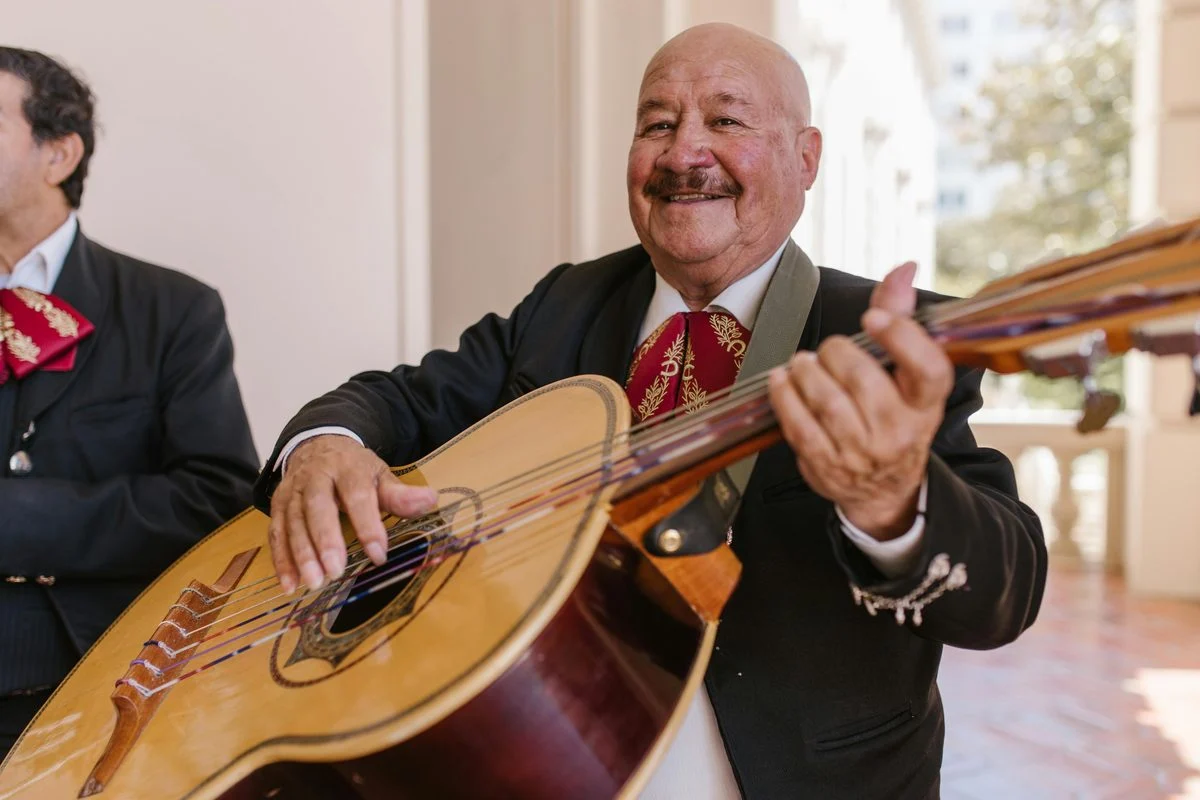 Student working through a mariachi vihuela & guitarrón exercise with a coach