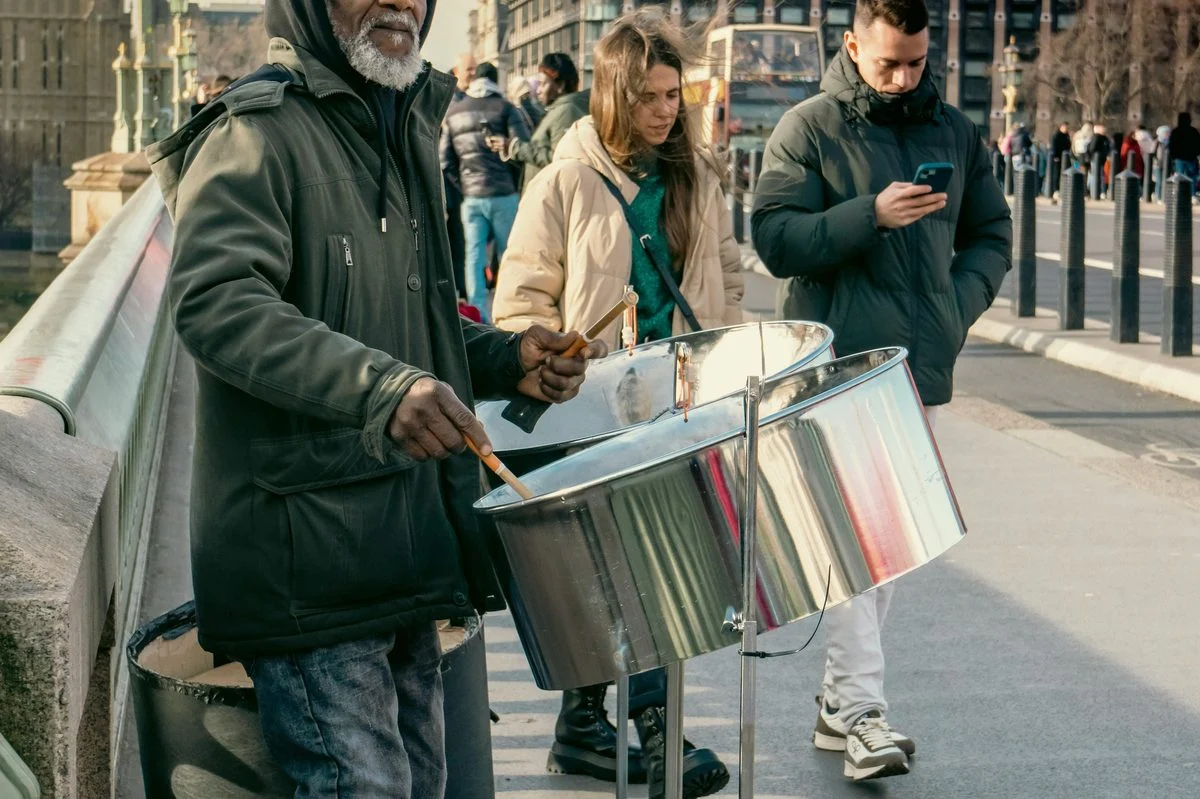 Student working through a steel pan exercise with a coach