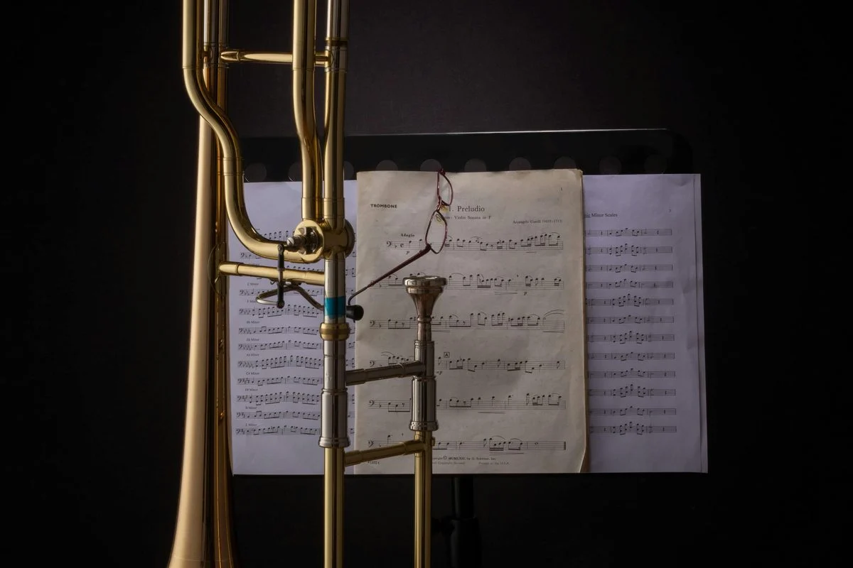 Student working through a trombone exercise with a coach